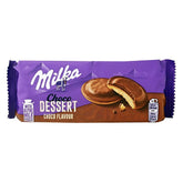 Milka Choco Dessert Choco Flavoured Jaffa cookies come in purple packaging and display a chocolate-covered biscuit with a creamy filling, ideal for chocolate enthusiasts. The Alpine milk branding highlights the indulgent Milka chocolate experience within.